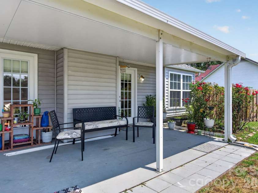 906 Woodhill Drive, Fletcher, NC 28732.  MLS# CAR4404575, YatesRealty ID 50283. Covered Back Patio