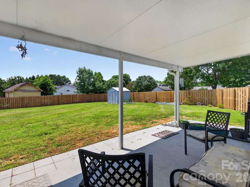906 Woodhill Drive, Fletcher, NC 28732.  MLS# CAR4404575, YatesRealty ID 50283. Covered Back Patio
