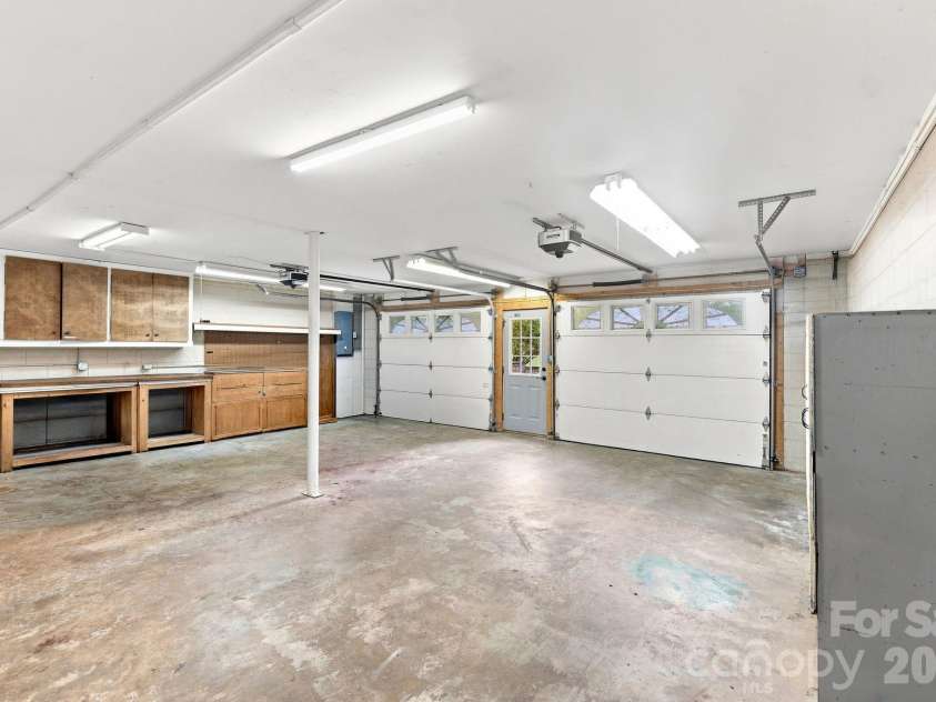 95 Holly Ridge Road, Waynesville, NC 28786.  MLS# CAR4423119, YatesRealty ID 50306. Double Garage with ample storage.