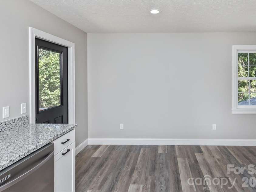 340 Matthew Lane, Canton, NC 28716.  MLS# CAR4423221, YatesRealty ID 50307. Kitchen looking into dining room area