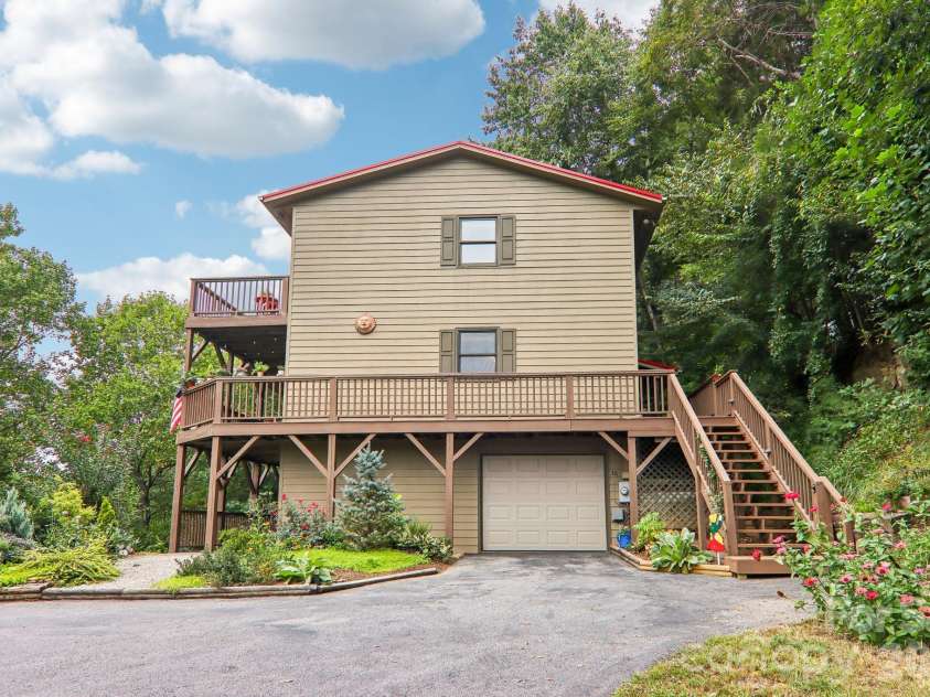 36 Nicholas Lane, Maggie Valley, NC 28751.  MLS# CAR4422932, YatesRealty ID 50311. Garage and wrap around porch