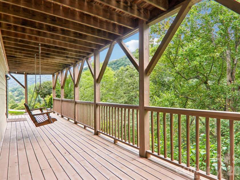 36 Nicholas Lane, Maggie Valley, NC 28751.  MLS# CAR4422932, YatesRealty ID 50311. Porch swing