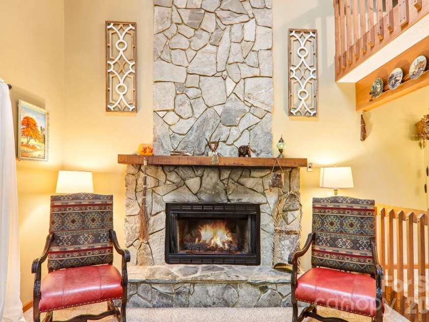 36 Nicholas Lane, Maggie Valley, NC 28751.  MLS# CAR4422932, YatesRealty ID 50311. Stone fireplace