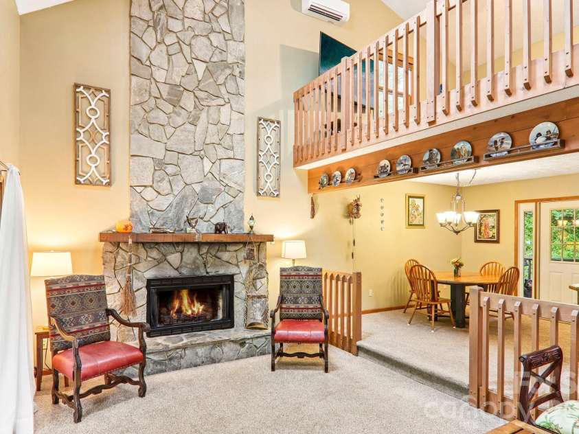 36 Nicholas Lane, Maggie Valley, NC 28751.  MLS# CAR4422932, YatesRealty ID 50311. Stone fireplace and loft