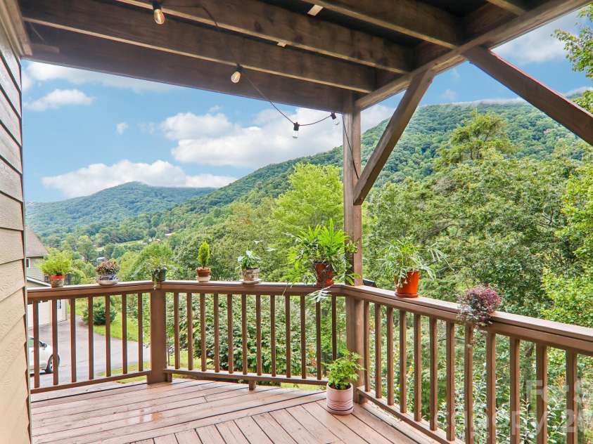 36 Nicholas Lane, Maggie Valley, NC 28751.  MLS# CAR4422932, YatesRealty ID 50311. Wrap around porch with eastern exposure