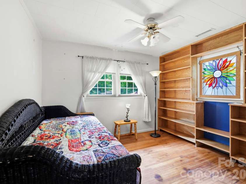 10687 Cruso Road, Canton, NC 28716.  MLS# CAR4423169, YatesRealty ID 50320. Bedroom 2 with built-ins