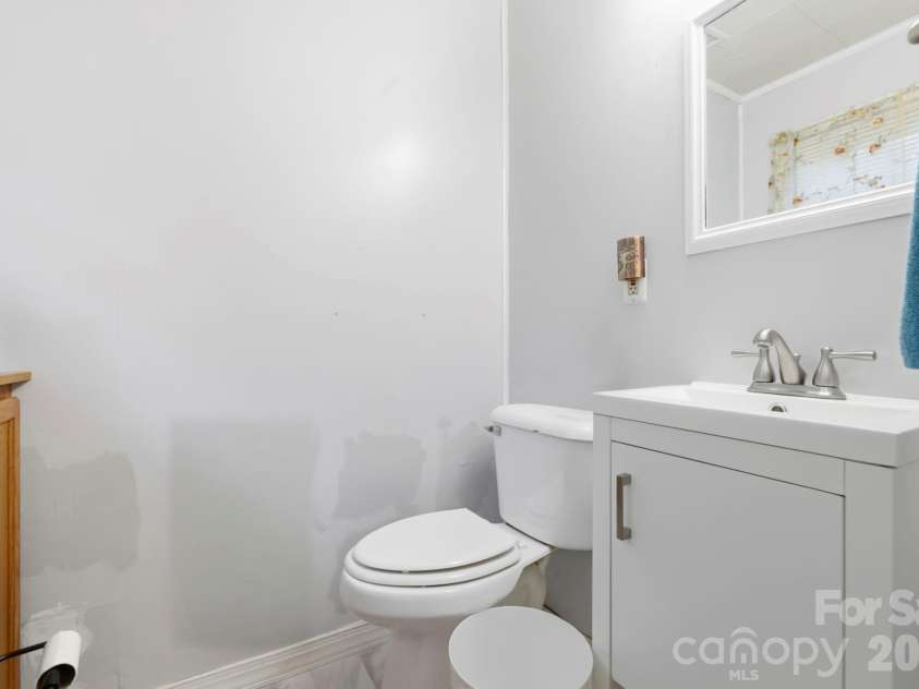 10687 Cruso Road, Canton, NC 28716.  MLS# CAR4423169, YatesRealty ID 50320. Half bath in main bedroom
