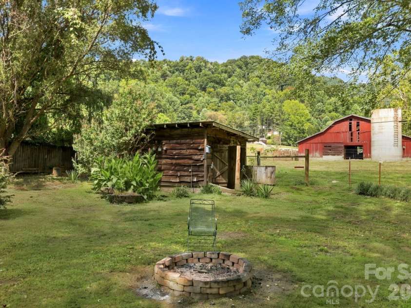 10687 Cruso Road, Canton, NC 28716.  MLS# CAR4423169, YatesRealty ID 50320. Outbuilding #1 in background of firepit