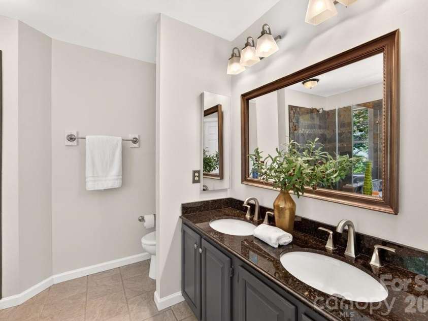 2901 Firewood Drive, Matthews, NC 28105.  MLS# CAR4422763, YatesRealty ID 50324. Dual vanities.