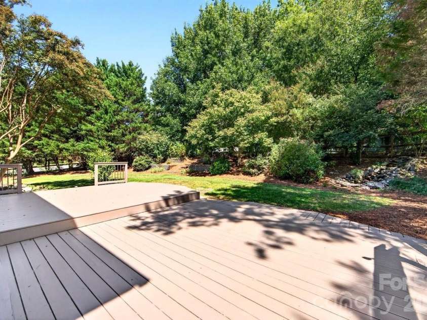 2901 Firewood Drive, Matthews, NC 28105.  MLS# CAR4422763, YatesRealty ID 50324. Grand deck for great entertaining space outdoors!