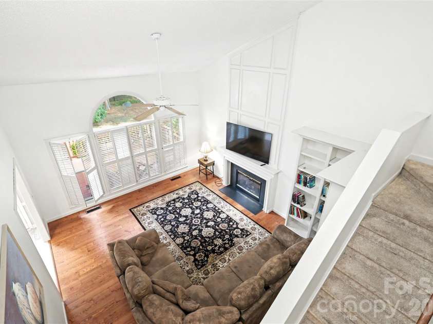 7903 Long Nook Lane, Charlotte, NC 28277.  MLS# CAR4414616, YatesRealty ID 50326. Back staircase with neutral carpet has easy access from den