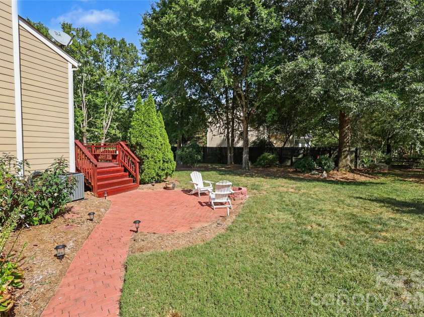 7903 Long Nook Lane, Charlotte, NC 28277.  MLS# CAR4414616, YatesRealty ID 50326. Brick patio and walkway. Firepit
