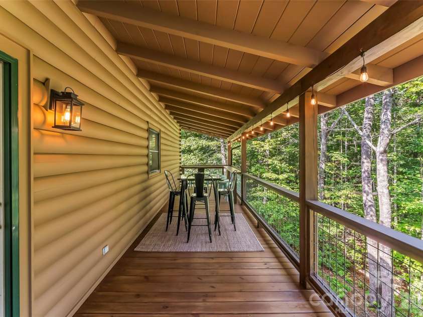 85 Trellis Drive, Nebo, NC 28761.  MLS# CAR4422991, YatesRealty ID 50327. Private covered back porch