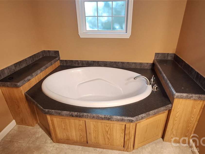 120 Otto Road, Cherryville, NC 28021.  MLS# CAR4411416, YatesRealty ID 50330. Glamour tub in Master Bath