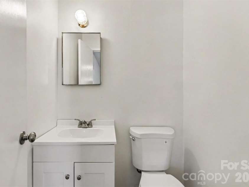 701 Bilmark Avenue, Charlotte, NC 28213.  MLS# CAR4421926, YatesRealty ID 50349. Half bathroom in primary bedroom