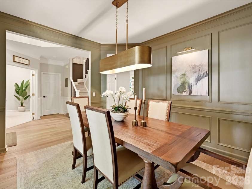 19706 Valiant Way, Cornelius, NC 28031.  MLS# CAR4423741, YatesRealty ID 50358. Additional dining room view highlights the beautiful millwork and easy connection to the kitchen and foyer.