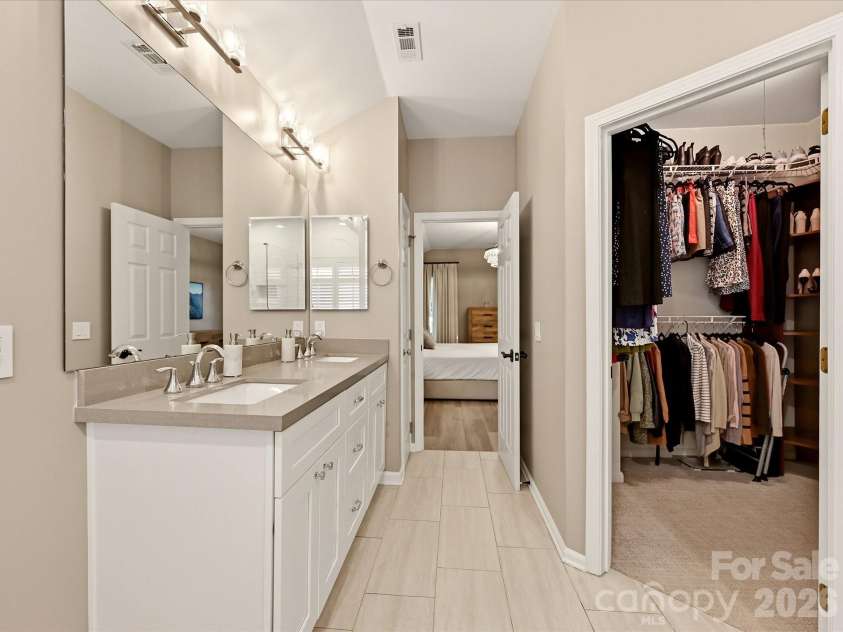 19706 Valiant Way, Cornelius, NC 28031.  MLS# CAR4423741, YatesRealty ID 50358. Additional primary bath view highlights the dual vanity, generous storage, and adjoining walk-in closet.