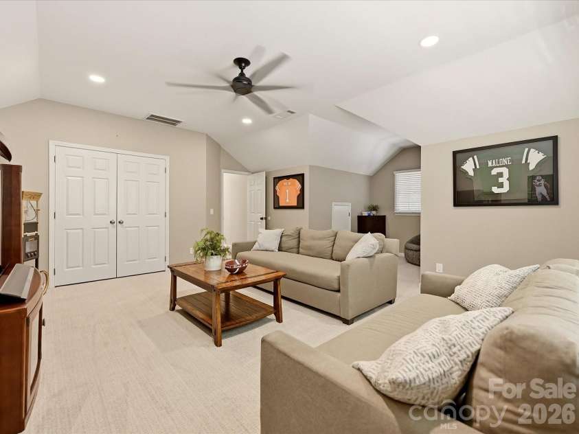 19706 Valiant Way, Cornelius, NC 28031.  MLS# CAR4423741, YatesRealty ID 50358. Spacious bonus room provides flexible additional living space with a vaulted ceiling and abundant room for entertaining or relaxing.