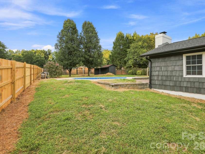 452 Mirror Lake Road, Salisbury, NC 28146.  MLS# CAR4423689, YatesRealty ID 50367. Side of house and pool