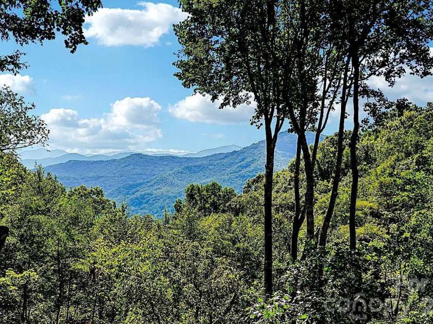 476 Waterford Drive, Maggie Valley, NC 28751.  MLS# CAR4423224, YatesRealty ID 50368. Layers upon Layers of distant views