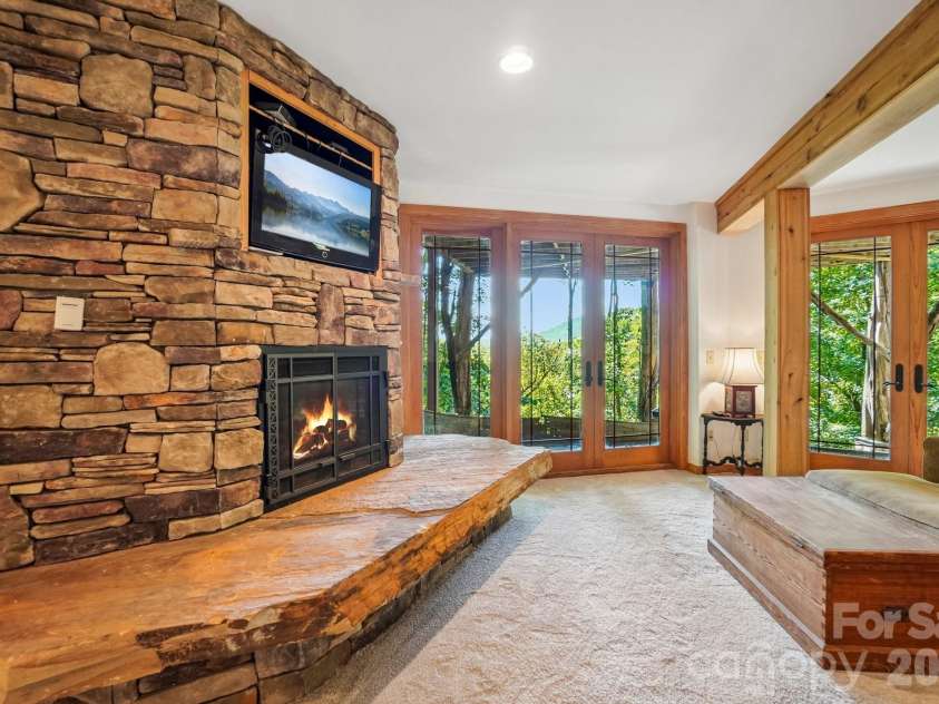 476 Waterford Drive, Maggie Valley, NC 28751.  MLS# CAR4423224, YatesRealty ID 50368. Note the slab for the hearth on lower level - Solid stone fireplace  -