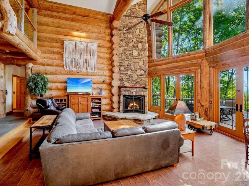 476 Waterford Drive, Maggie Valley, NC 28751.  MLS# CAR4423224, YatesRealty ID 50368. Seating around the fireplace