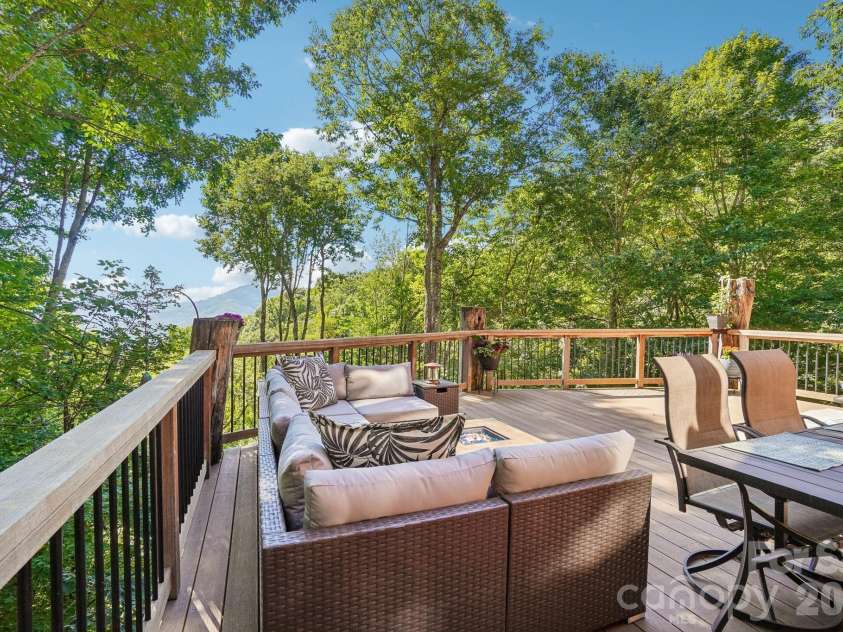 476 Waterford Drive, Maggie Valley, NC 28751.  MLS# CAR4423224, YatesRealty ID 50368. Spacious deck with views and ding and confy seating