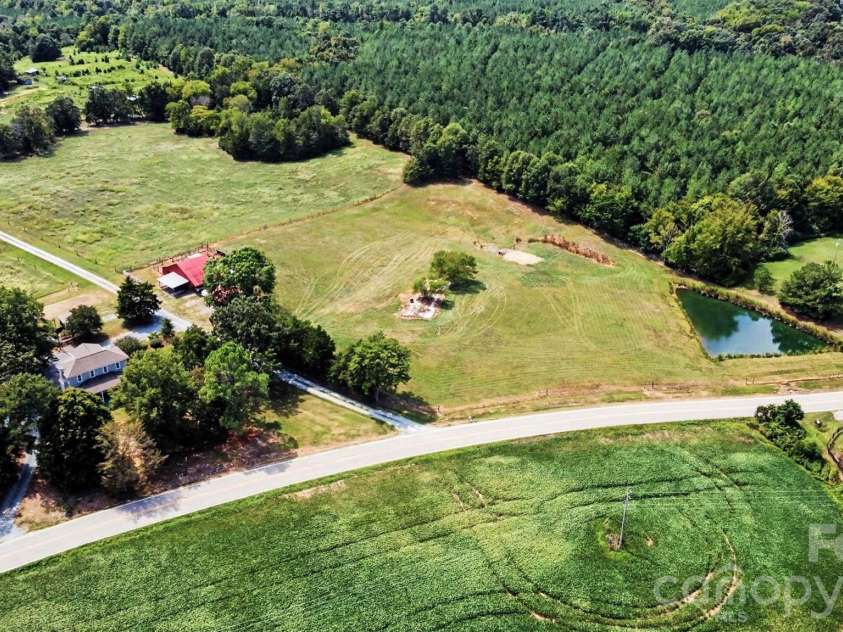 6002 White Store Road, Wingate, NC 28174.  MLS# CAR4420843, YatesRealty ID 50387. Overview with Pond