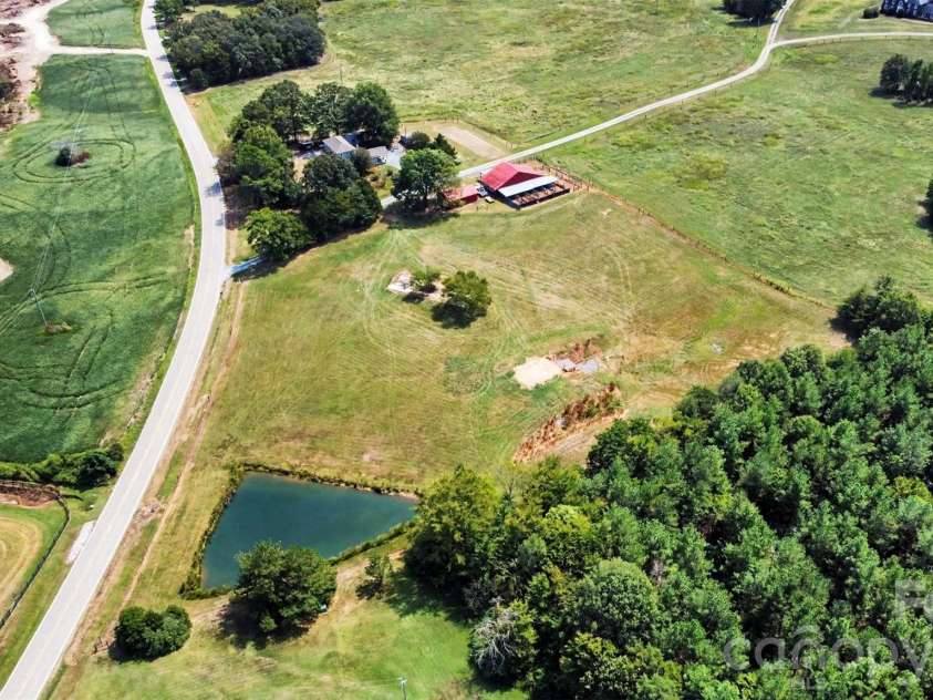 6002 White Store Road, Wingate, NC 28174.  MLS# CAR4420843, YatesRealty ID 50387. Overview with Pond