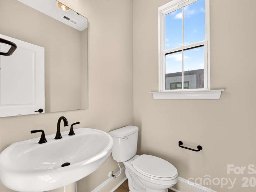 411 Old Town Village Road, Waxhaw, NC 28173.  MLS# CAR4423933, YatesRealty ID 50390. Second floor powder