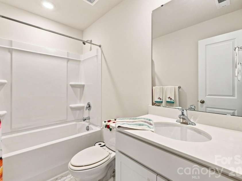 16 Madelyn Drive, Clyde, NC 28721.  MLS# CAR4423396, YatesRealty ID 50393. Bathroom upstairs
