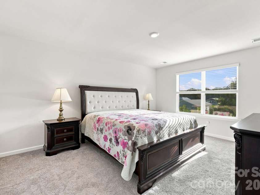 16 Madelyn Drive, Clyde, NC 28721.  MLS# CAR4423396, YatesRealty ID 50393. Master bedroom on upper level