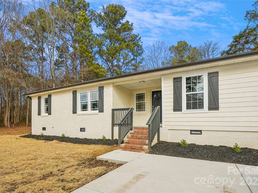 1105 Stanback Road, Chester, SC 29706.  MLS# CAR4212458, YatesRealty ID 5047. This listing features a spacious lot, a well-maintained exterior, and a peaceful wooded setting.