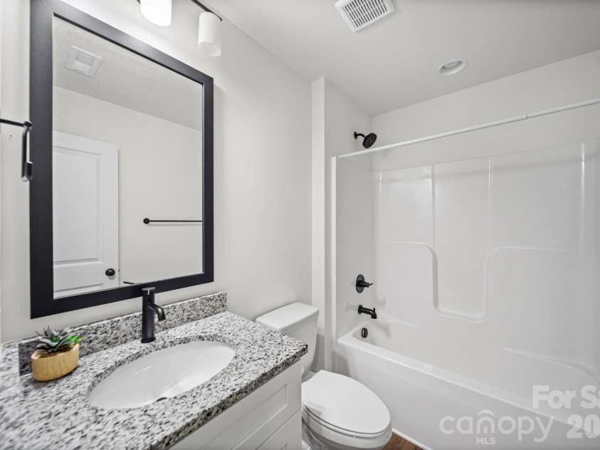844 Matthews School Road, Matthews, NC 28105.  MLS# CAR4423028, YatesRealty ID 50504. Guest Bathroom