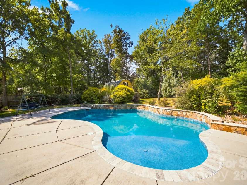 6821 Hollow Oak Drive, Mint Hill, NC 28227.  MLS# CAR4423362, YatesRealty ID 50505. Inground Pool with Waterfall!