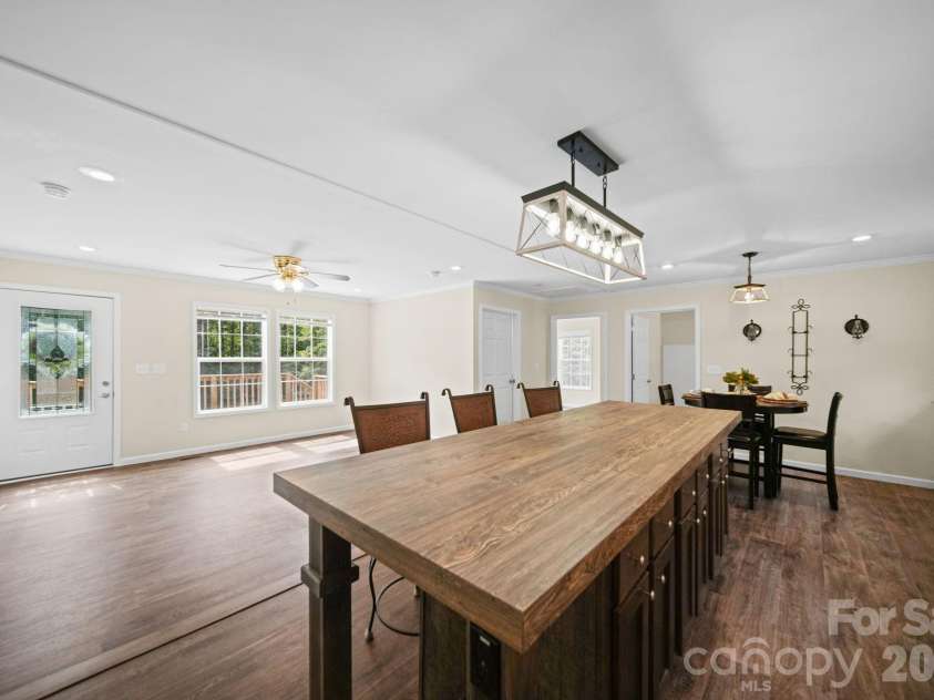 5756 Zion Hill Drive, Lawndale, NC 28090.  MLS# CAR4422782, YatesRealty ID 50508. This kitchen island features ample storage and seating for six.