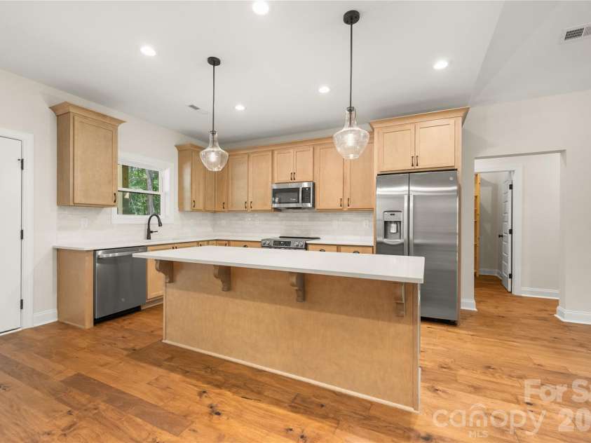 32 Ossarooga Court, Brevard, NC 28712.  MLS# CAR4423106, YatesRealty ID 50509. Breakfast bar & pendant lighting