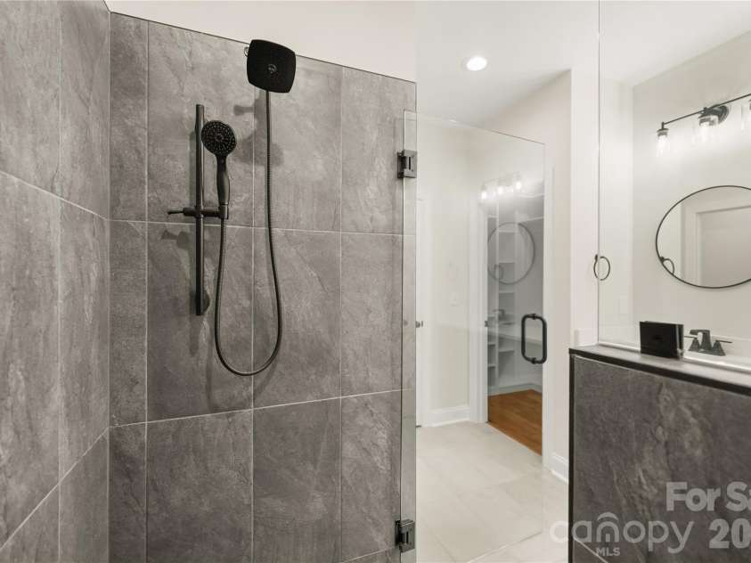 32 Ossarooga Court, Brevard, NC 28712.  MLS# CAR4423106, YatesRealty ID 50509. Custom tiled shower