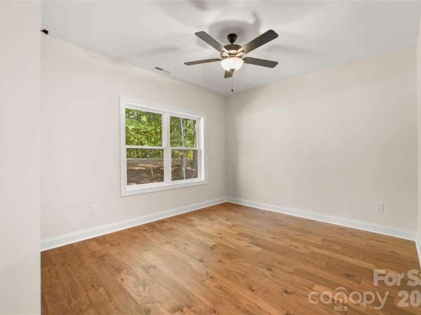 32 Ossarooga Court, Brevard, NC 28712.  MLS# CAR4423106, YatesRealty ID 50509. Guest room #2 faces the back yard