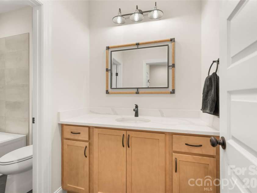 32 Ossarooga Court, Brevard, NC 28712.  MLS# CAR4423106, YatesRealty ID 50509. Handsome vanity & quartz countertops