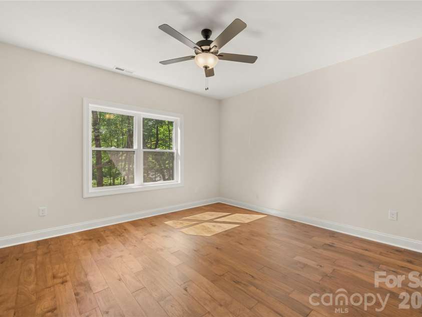 32 Ossarooga Court, Brevard, NC 28712.  MLS# CAR4423106, YatesRealty ID 50509. Primary bedroom faces the back yard