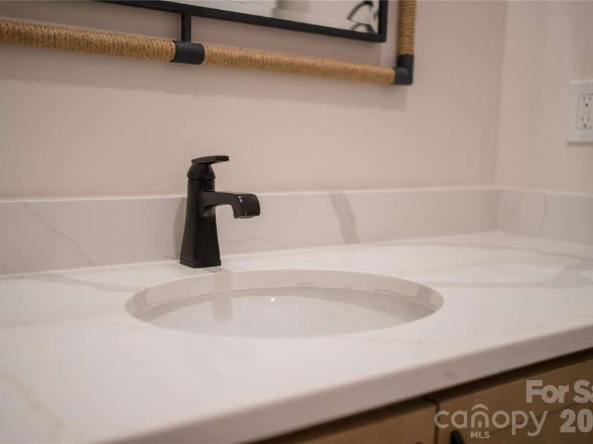 32 Ossarooga Court, Brevard, NC 28712.  MLS# CAR4423106, YatesRealty ID 50509. Quartz tops & subway tile