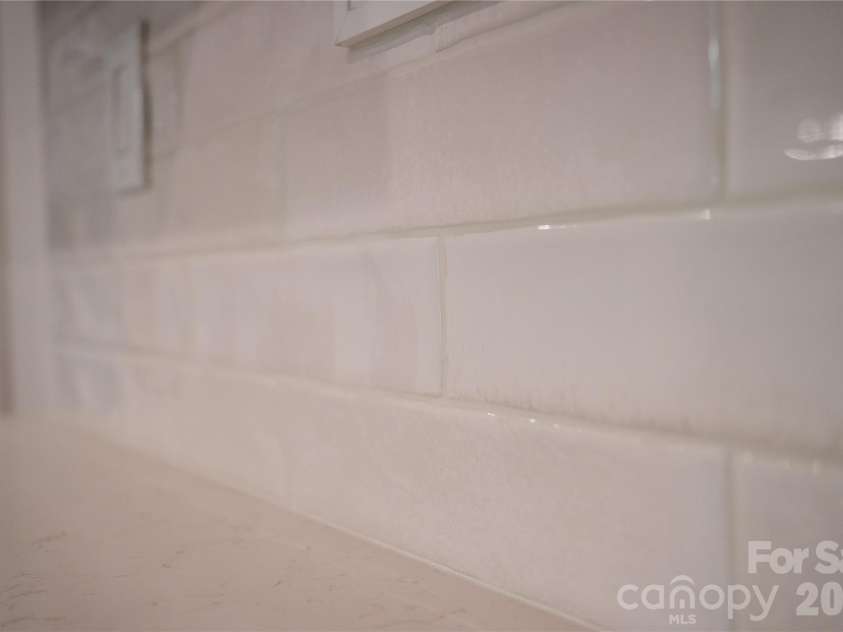 32 Ossarooga Court, Brevard, NC 28712.  MLS# CAR4423106, YatesRealty ID 50509. Subway tile backsplash...