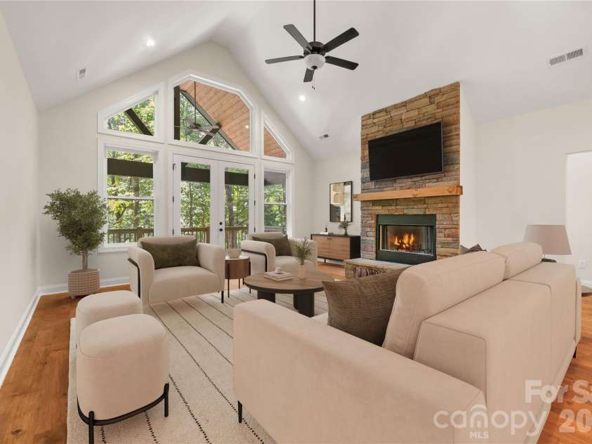 32 Ossarooga Court, Brevard, NC 28712.  MLS# CAR4423106, YatesRealty ID 50509. Vaulted ceilings & wall of windows keep the space bright & airy
