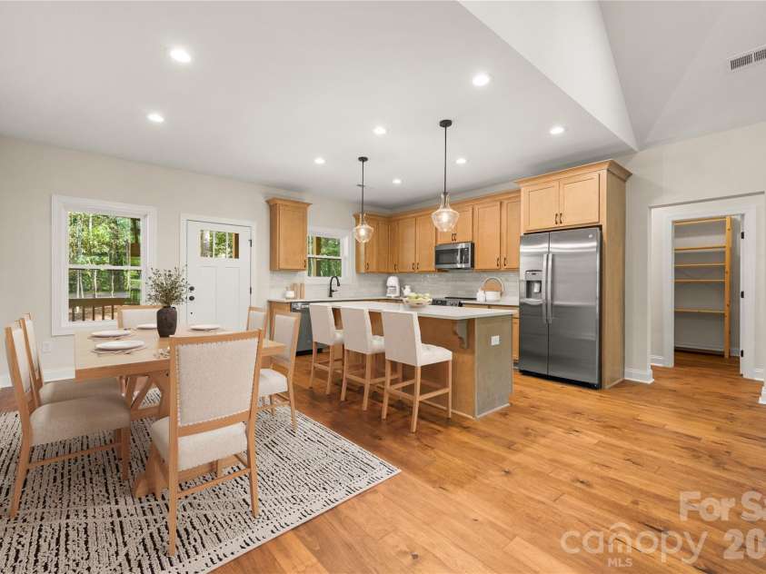 32 Ossarooga Court, Brevard, NC 28712.  MLS# CAR4423106, YatesRealty ID 50509. Virtual staging shows dining area
