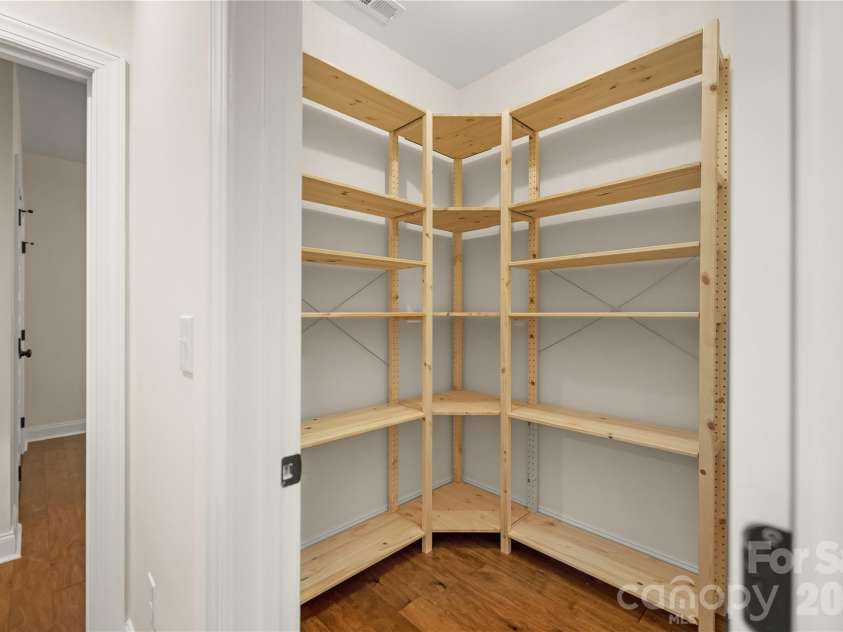 32 Ossarooga Court, Brevard, NC 28712.  MLS# CAR4423106, YatesRealty ID 50509. Walk in pantry with shelving