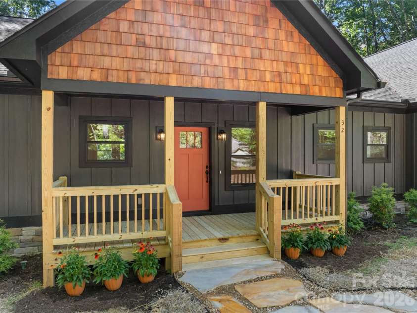 32 Ossarooga Court, Brevard, NC 28712.  MLS# CAR4423106, YatesRealty ID 50509. Welcoming covered front porch..