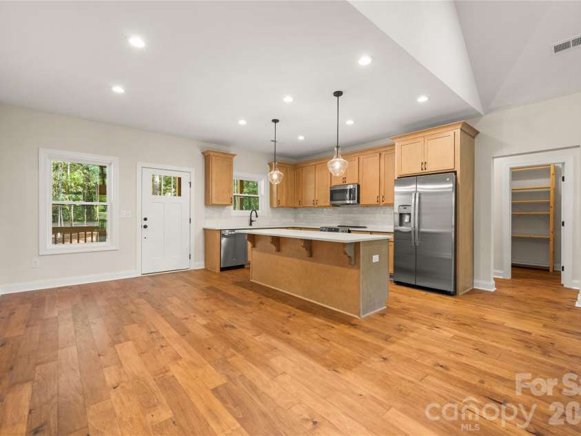 32 Ossarooga Court, Brevard, NC 28712.  MLS# CAR4423106, YatesRealty ID 50509. Wood floors create continuity