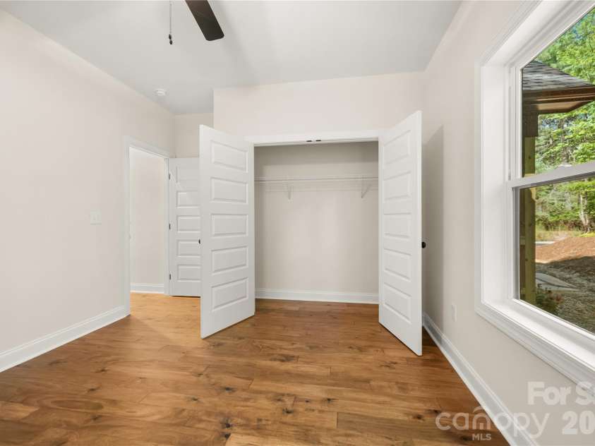 32 Ossarooga Court, Brevard, NC 28712.  MLS# CAR4423106, YatesRealty ID 50509. Wood floors & large windows