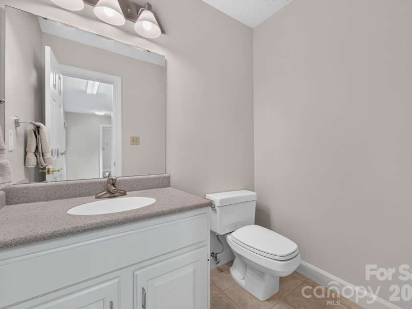 3517 Honeysuckle Drive, Matthews, NC 28104.  MLS# CAR4423576, YatesRealty ID 50513. Powder Room off Garage